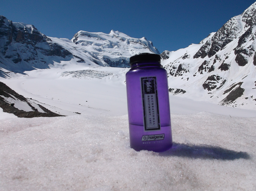 Water bottle in front of the Grand Combin